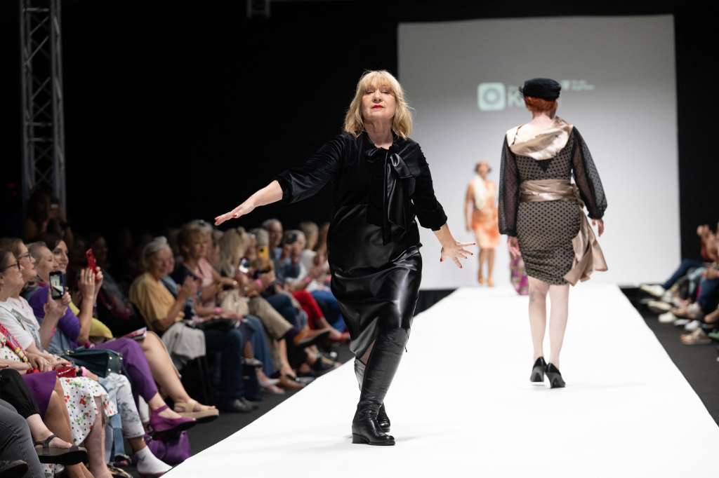 Members of a group of retired people present their own line of upcycled clothes the Vienna Fashion week at the Museum Quartier in Vienna, Austria on September 10, 2023.