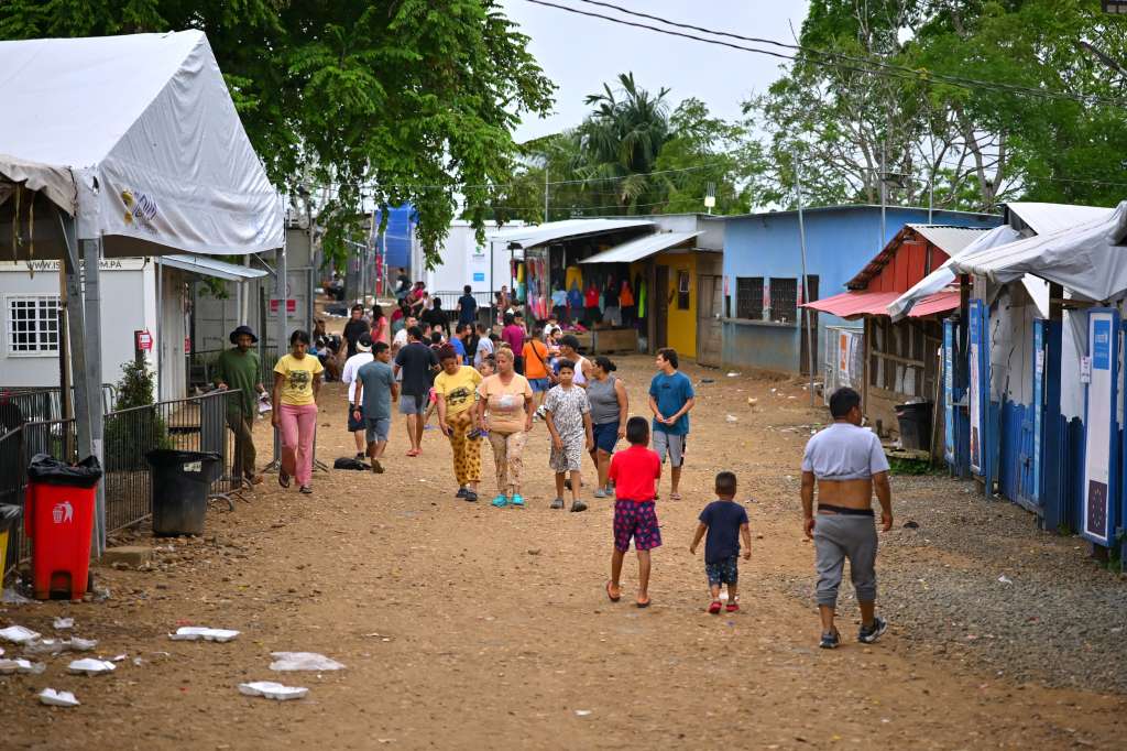 (FILES) Migrants walk at the Temporary Reception Centre for Migrants in Lajas Blancas, in the jungle province of Darien, 250 km east of Panama City, Panama, on September 26, 2024.