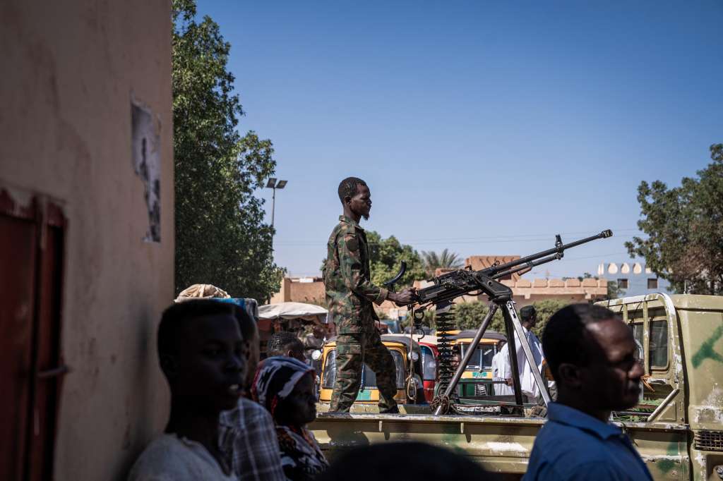 (FILES) A Sudanese army soldier mans a machine gun on top of a military pickup truck outside a hospital in Omdurman on November 2, 2024.