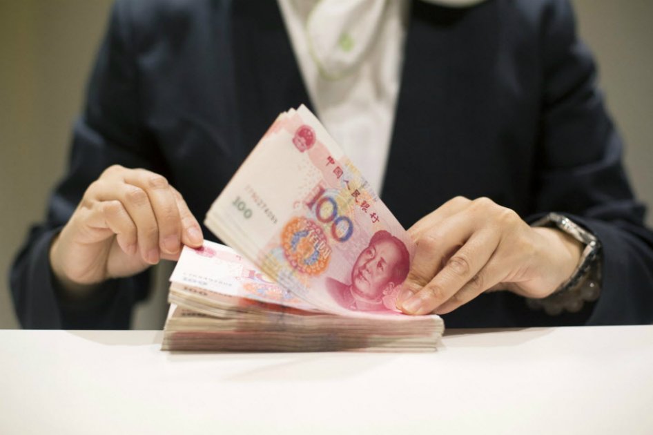 La inclusión del yuan en la cesta de monedas del FMI conlleva ciertos compromisos, dicen analistas. / Bloomberg News