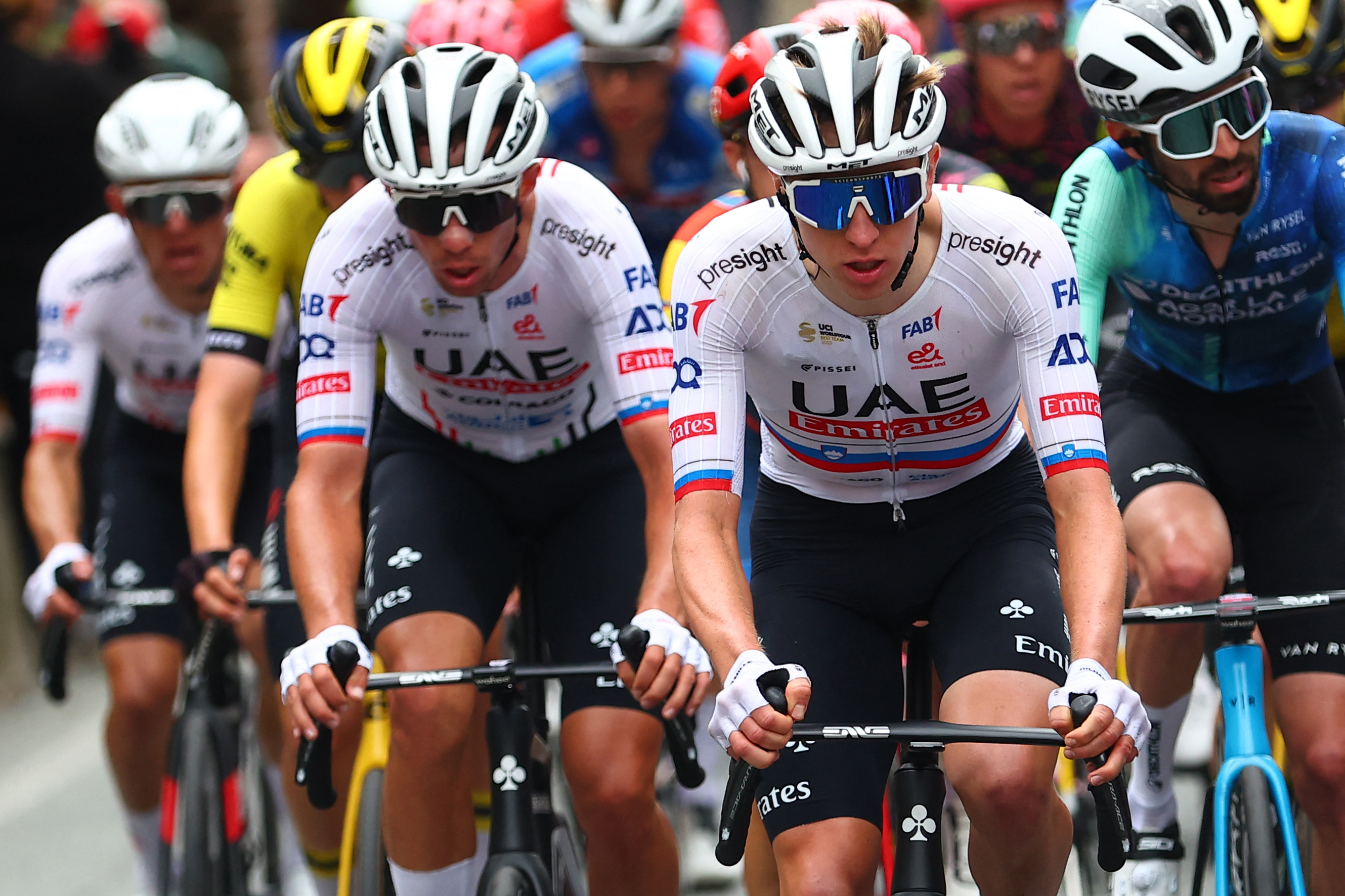 Team UAE's Slovenian rider Tadej Pogacar (C) competes in the pack during the 2nd stage of the 107th Giro d'Italia cycling race, 161km between San Francesco al Campo and Sanctuary of Oropa (Biella), on May 5, 2024. (Photo by Luca Bettini / AFP)