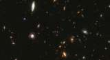 Científicos revelan qué son los misteriosos “pequeños puntos rojos” en el universo