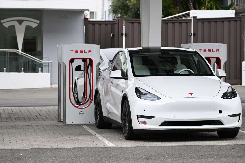 (FILES) A Tesla electric vehicle charges at a Tesla Supercharger location in Santa Monica, California on May 15, 2024.