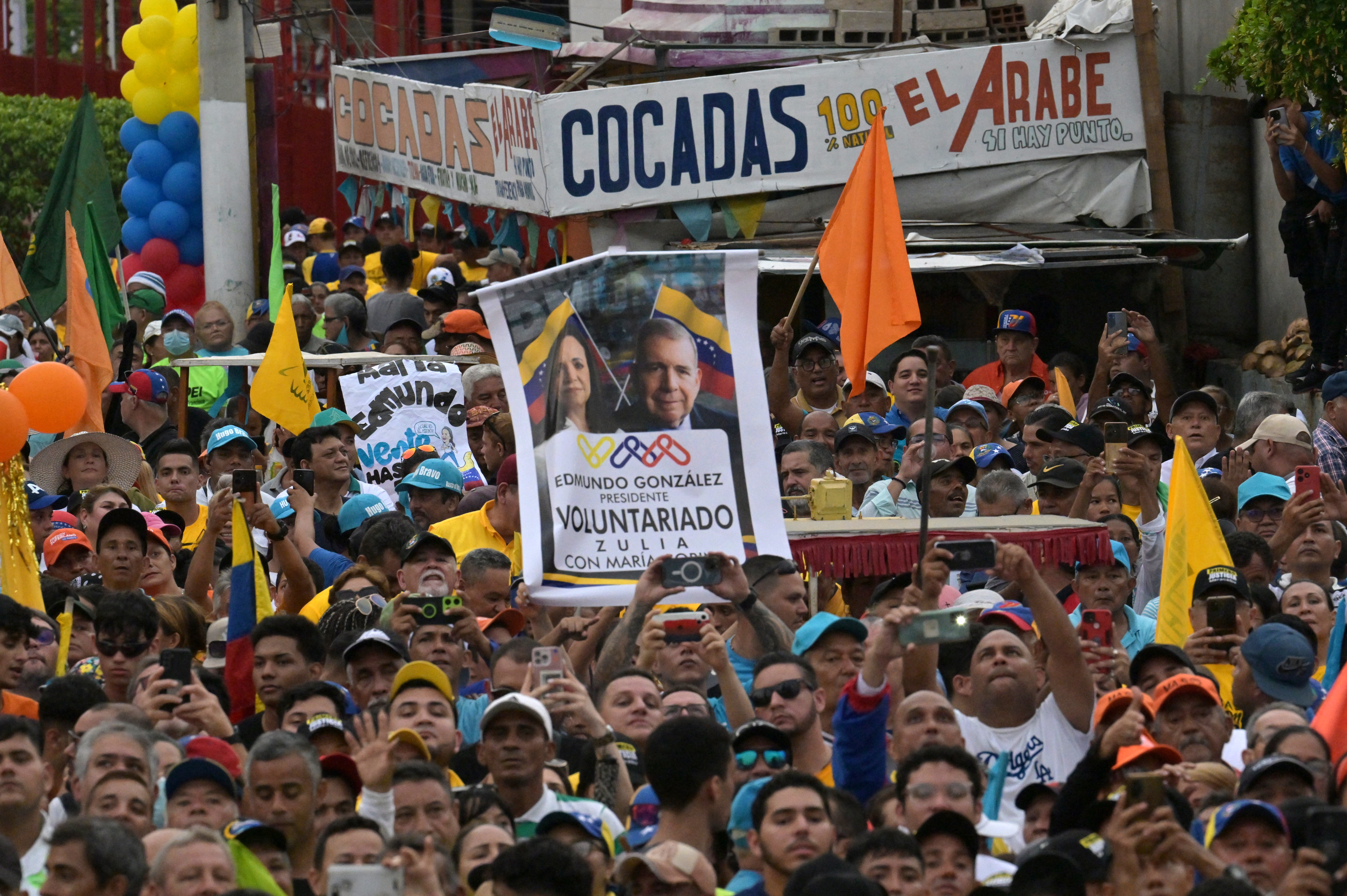 Supporters listen to Venezuelan opposition leader Maria Corina Machado during a rally in Maracaibo, Zulia State, Venezuela, on May 2, 2024.