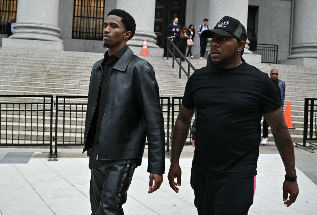 Christian Combs (L), son of rapper and music producer Sean "Diddy" Combs, leave federal court after their father's bail hearing in New York on September 18, 2024.