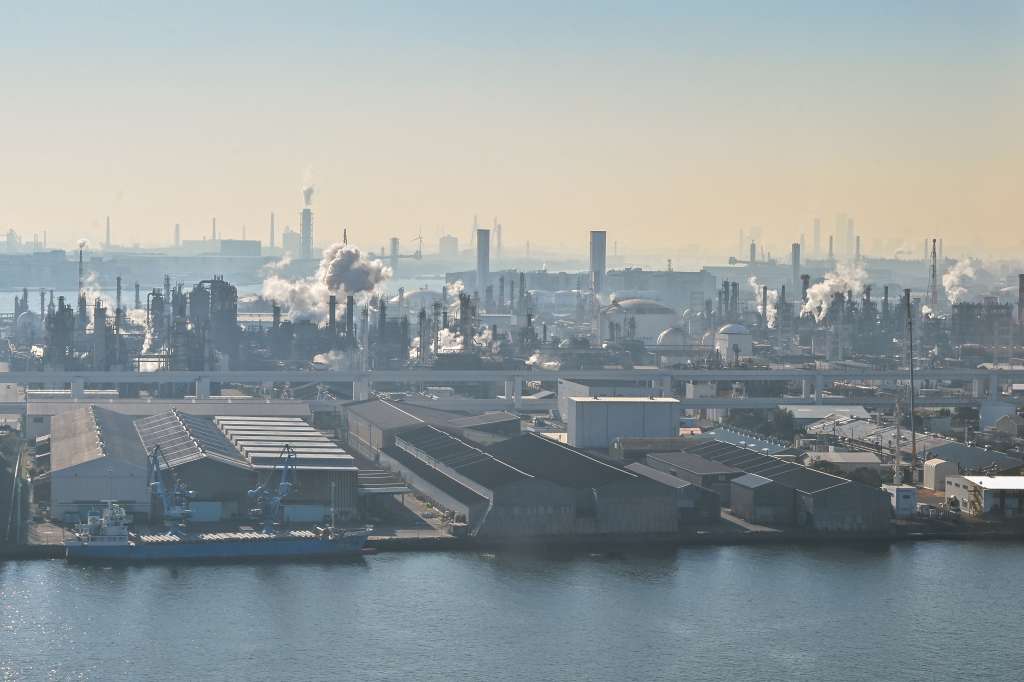 (FILES) This photo taken on December 29, 2023 shows the industrial area of Ukishima-cho in the city of Kawasaki, Kanagawa prefecture, across the water from Tokyo International Airport at Haneda.