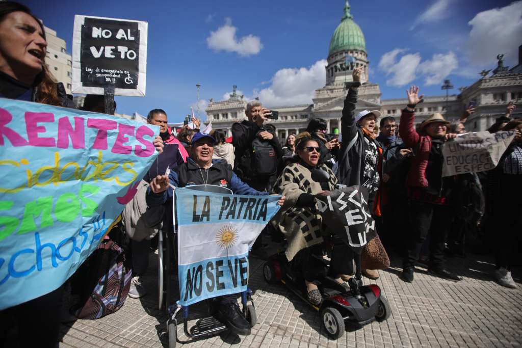Demonstrators gather outside the Congress in Buenos Aires on September 4, 2025, as the Senate votes on whether to overturn a presidential veto on a law increasing pensions for the disabled.