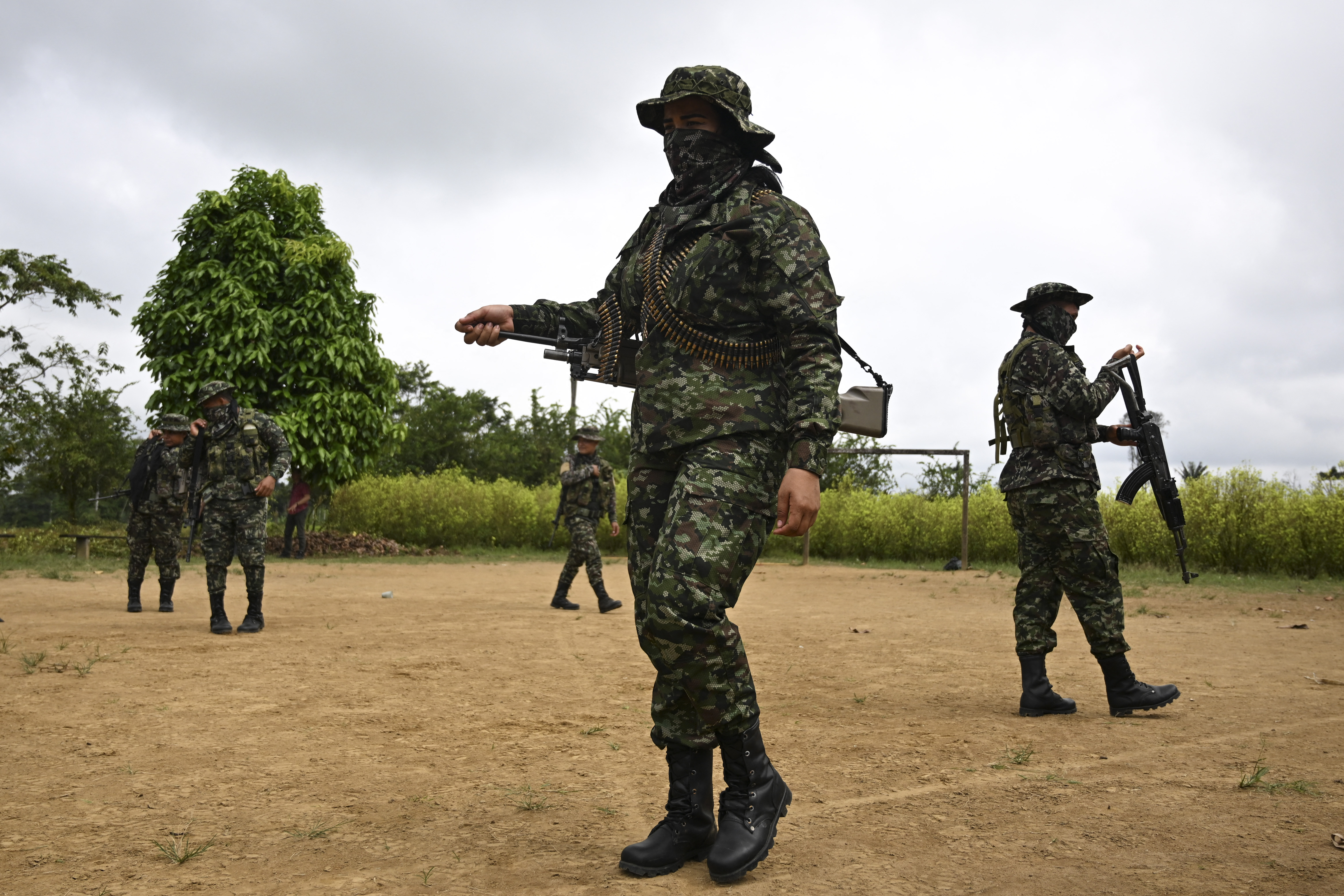 Members of the FARC dissident group Segunda Marquetalia form up at a farm in Llorente, a rural area of the port city of Tumaco, department of Narino, Colombia, on August 31, 2024.