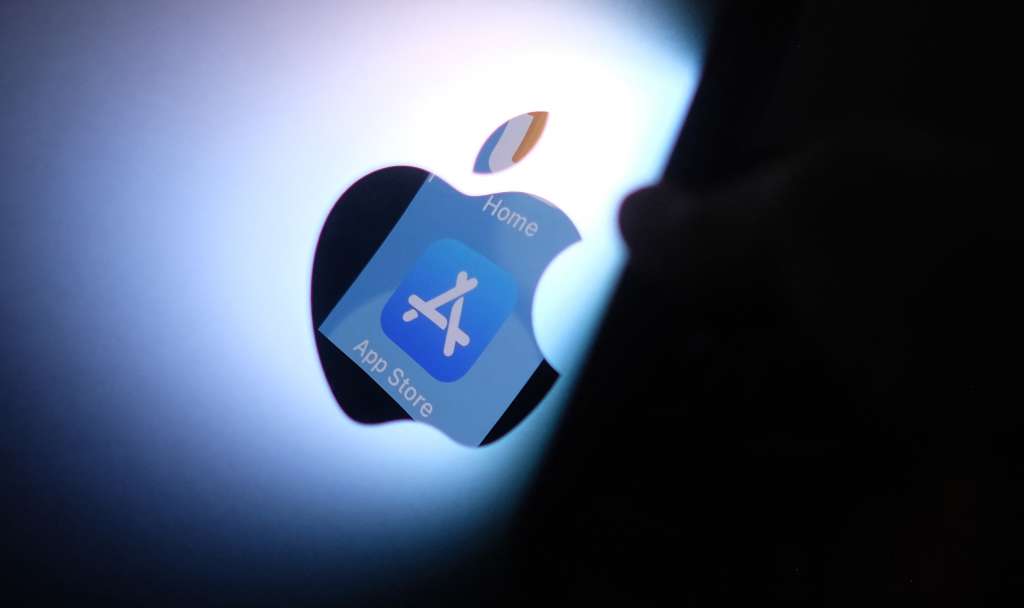 (FILES) This illustration photo shows the Apple app store logo reflected from an iPhone onto the back of an iMac in Los Angeles, August 26, 2021.