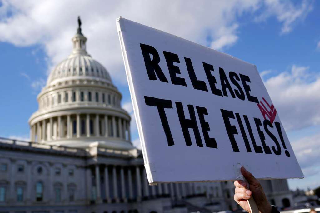 WASHINGTON (United States), 12/11/2025.- A protester holds a sign asking for the release of the Epstein files outside the US Capitol in Washington, DC, USA, 12 November 2025. House Democrats released emails on 12 November from Jeffrey Epstein estate. Members of the House of Representatives have called for the release of all files related to the crimes of the late convicted sex offender Jeffery Epstein. EFE/EPA/WILL OLIVER