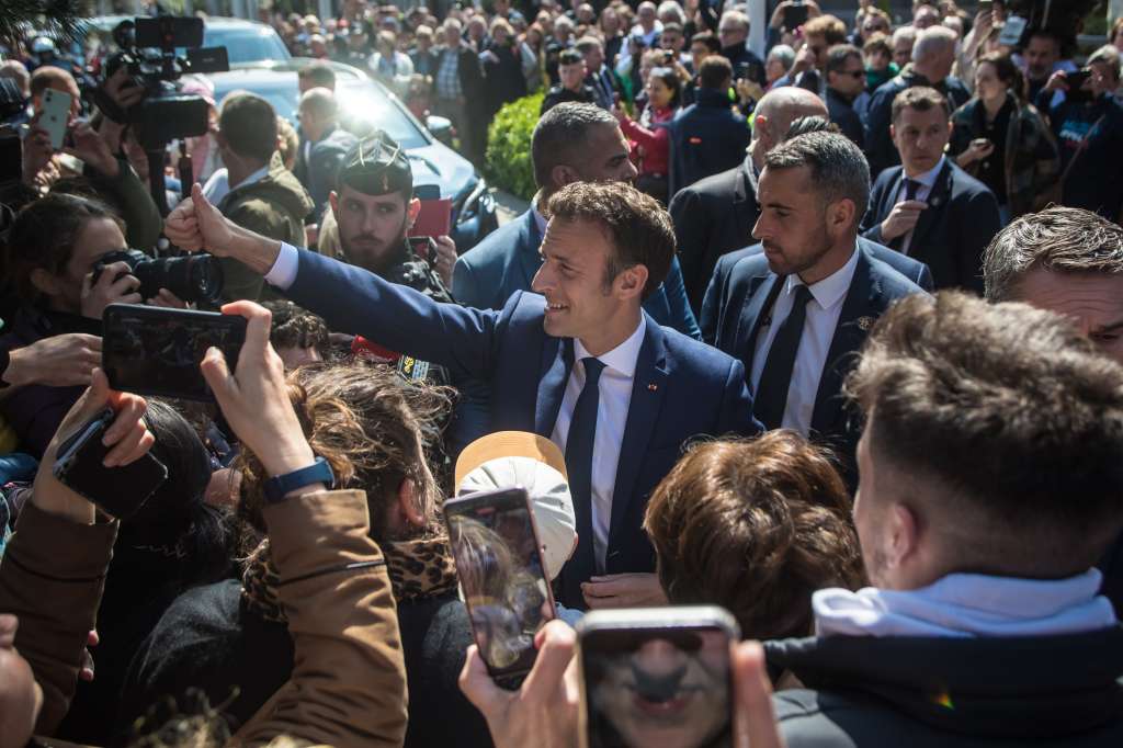 Le Touquet (France), 24/04/2022.- French President and candidate for re-election Emmanuel Macron (C) greets people before going to a polling station in the second round of the French presidential elections, in Le Touquet, France, 24 April 2022. (Elecciones, Francia) EFE/EPA/Christophe Petit Tesson