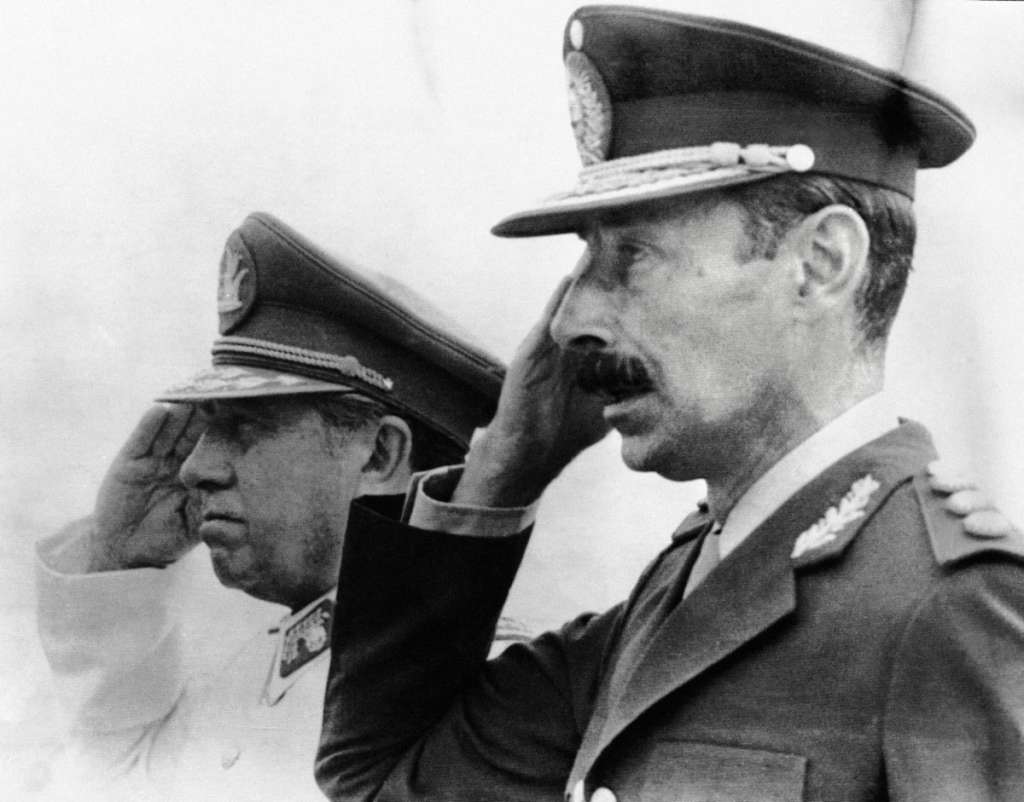 (FILES) Photograph taken in Chile in 1978 of Chilean dictator (1973-90) general Augusto Pinochet (L) and his Argentine counterpart general Jorge Videla.