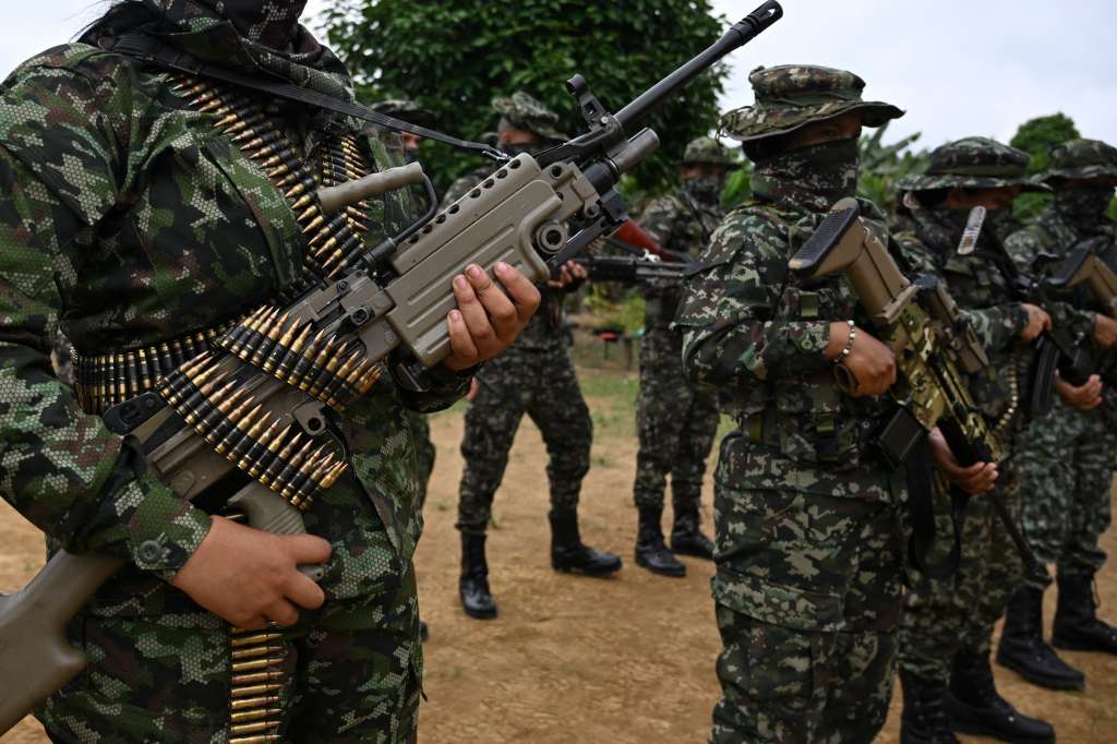 Members of the FARC dissident group Segunda Marquetalia form up at a farm in Llorente, a rural area of the port city of Tumaco, department of Narino, Colombia, on August 31, 2024.