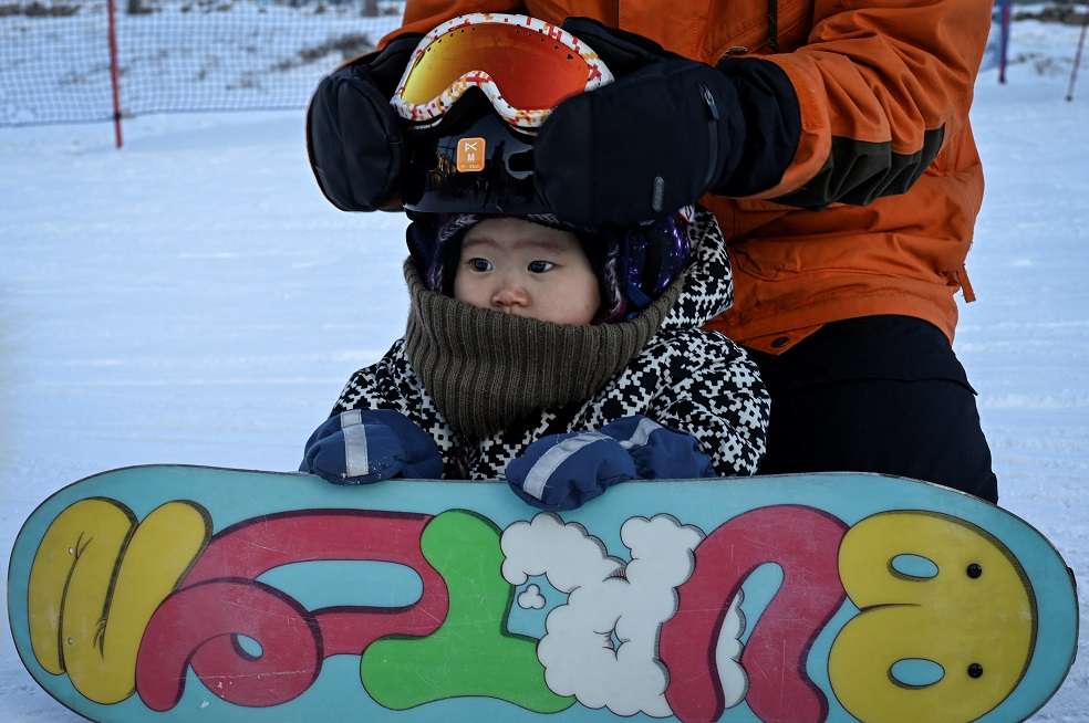 Bebé snowboarding