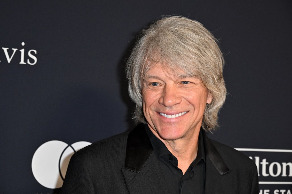 (FILES) US singer-songwriter Jon Bon Jovi arrives for the Recording Academy and Clive Davis' Salute To Industry Icons pre-Grammy gala at the Beverly Hilton hotel in Beverly Hills, California on February 3, 2024. - Bon Jovi was celebrated this week, not for a new song, but for helping a woman in need, according to police. The Grammy-winning rocker was shooting a video on September 10, 2024, on the John Seigenthaler Pedestrian Bridge in Nashville, Tennessee, when he and another person saw a woman standing outside the guard railing of the bridge and helped her to safety, US entertainment outlet Deadline reported. (Photo by Robyn BECK / AFP)