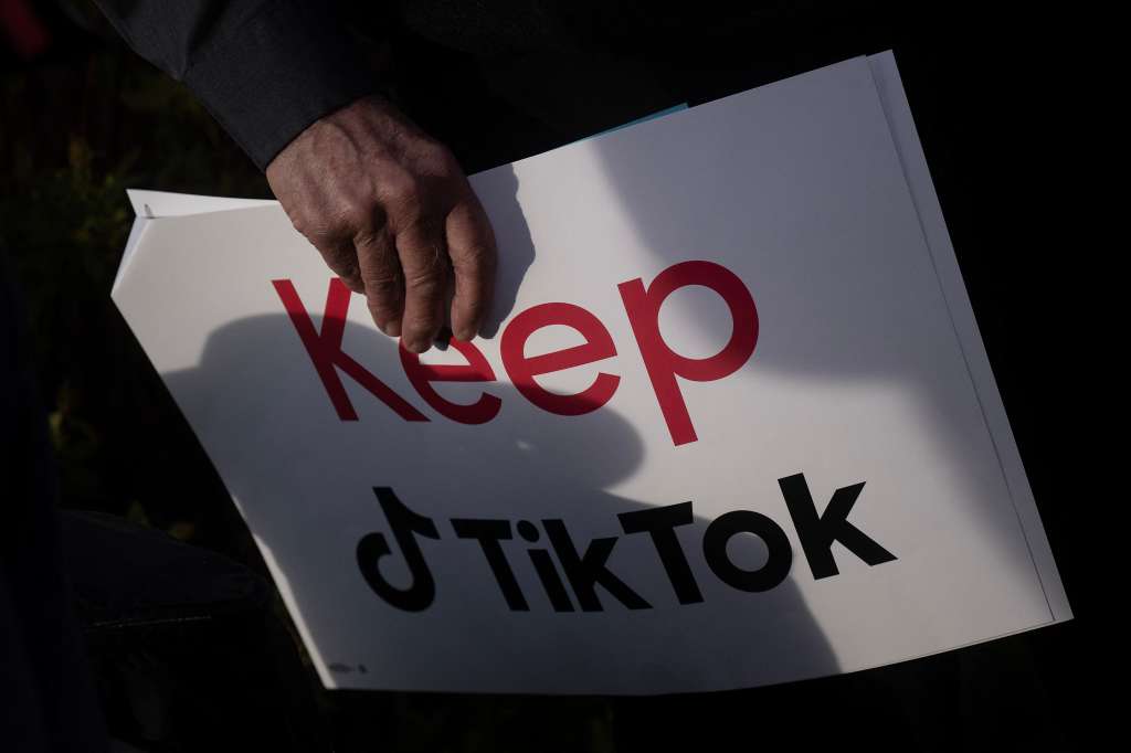 (FILES) A person holds a sign during a press conference about their opposition to a TikTok ban on Capitol Hill in Washington, DC on March 22, 2023.