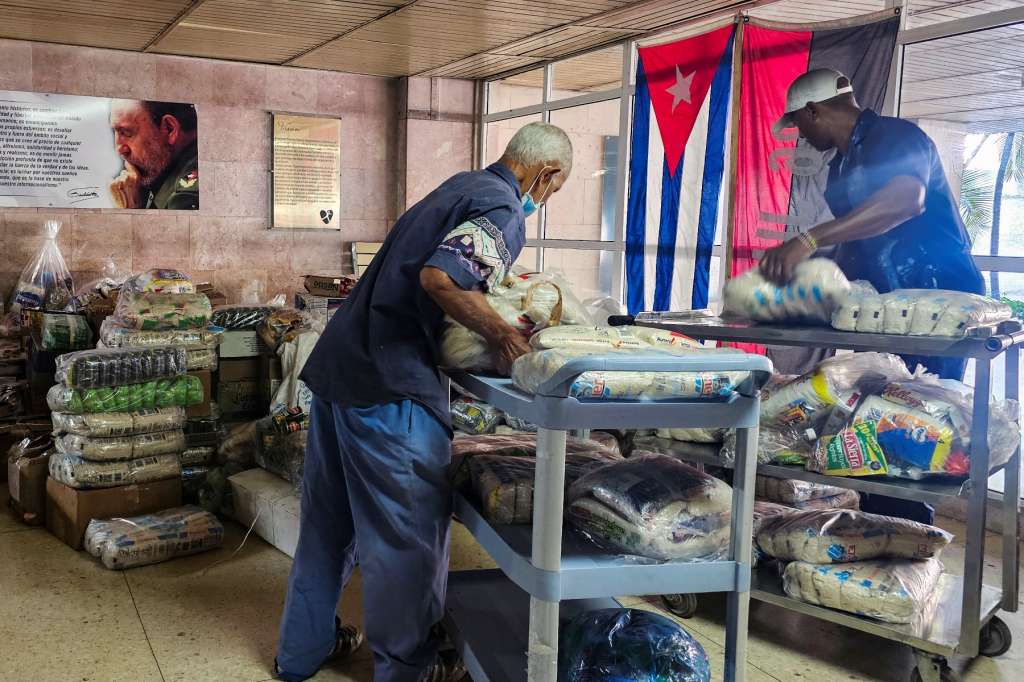 Aid brought by the Nuestra America flotilla from Mexico is classified at the William Soler Pediatric Cardiocenter in Havana on March 25, 2026. (Photo by Lisandra COTS / AFP)