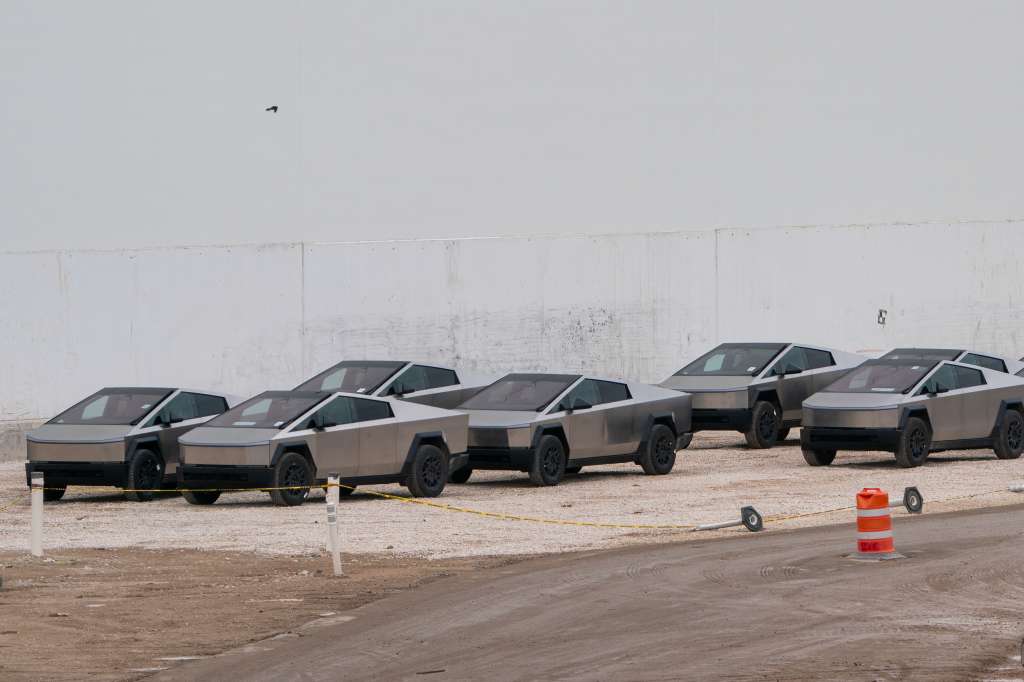 (FILES) Newly manufactured Tesla Cybertrucks are parked outside the company's Giga Texas factory on December 13, 2023, in Austin, Texas.