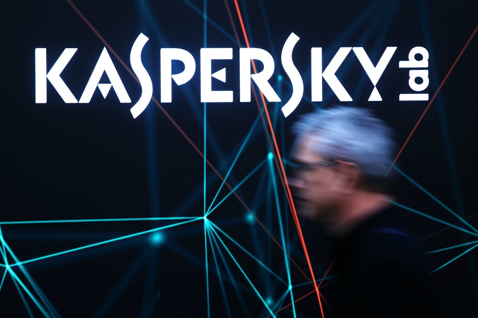 A visitor passes the Kaspersky Lab pavilion at the CeBIT 2017 tech fair in Hannover, Germany, on Tuesday, March 21, 2017. Leading edge technologies in the digital world are showcased in this annual event which runs March 20 - 24. Photographer: Krisztian Bocsi/Bloomberg