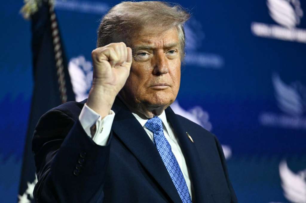 US President Donald Trump pumps his fist after speaking at the Faith & Freedom Coalition's 2026 Policy Conference at the Washington Hilton in Washington, DC, on June 26, 2026.