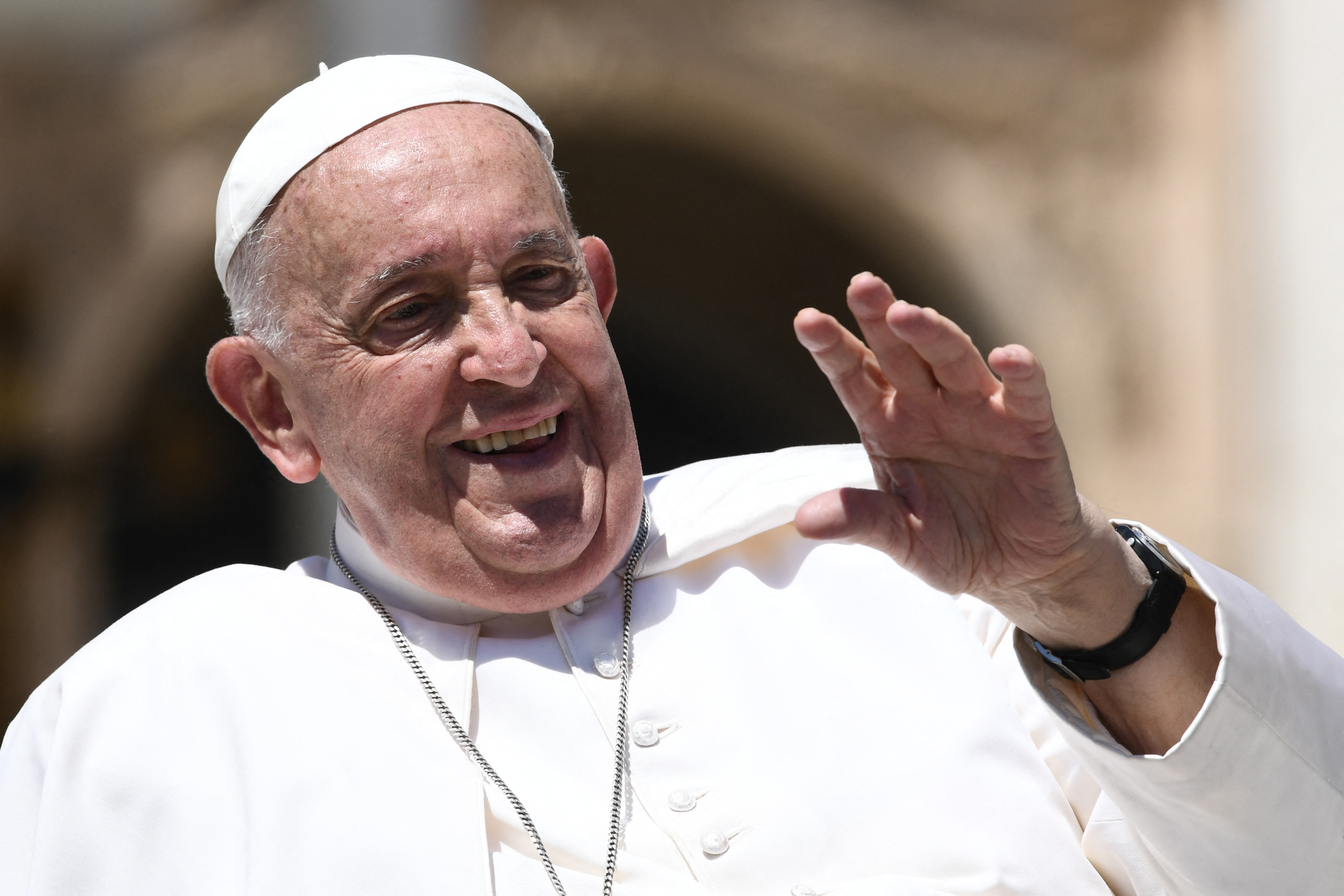 Pope Francis greets people at the end of the weekly general audience on June 12, 2024 at St Peter's square in The Vatican. (Photo by Isabella BONOTTO / AFP)