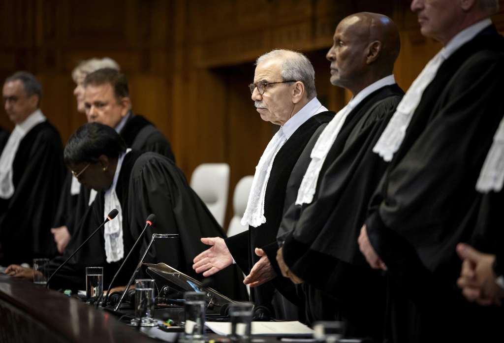The Hague (Netherlands), 24/05/2024.- International Court of Justice (ICJ) President Nawaf Salam (C) stands during an ICJ ruling over the situation in Rafah, southern Gaza Strip, in the Hague, Netherlands, 24 May 2024. The ICJ on 24 May ordered Israel to halt its military operation in Rafah, to open the Rafah border crossing with Egypt to allow for the entry of humanitarian aid, to allow access to Gaza for investigators, and to report to the court within one month on its progress. (Egipto, Países Bajos; Holanda, La Haya) EFE/EPA/Koen van Weel