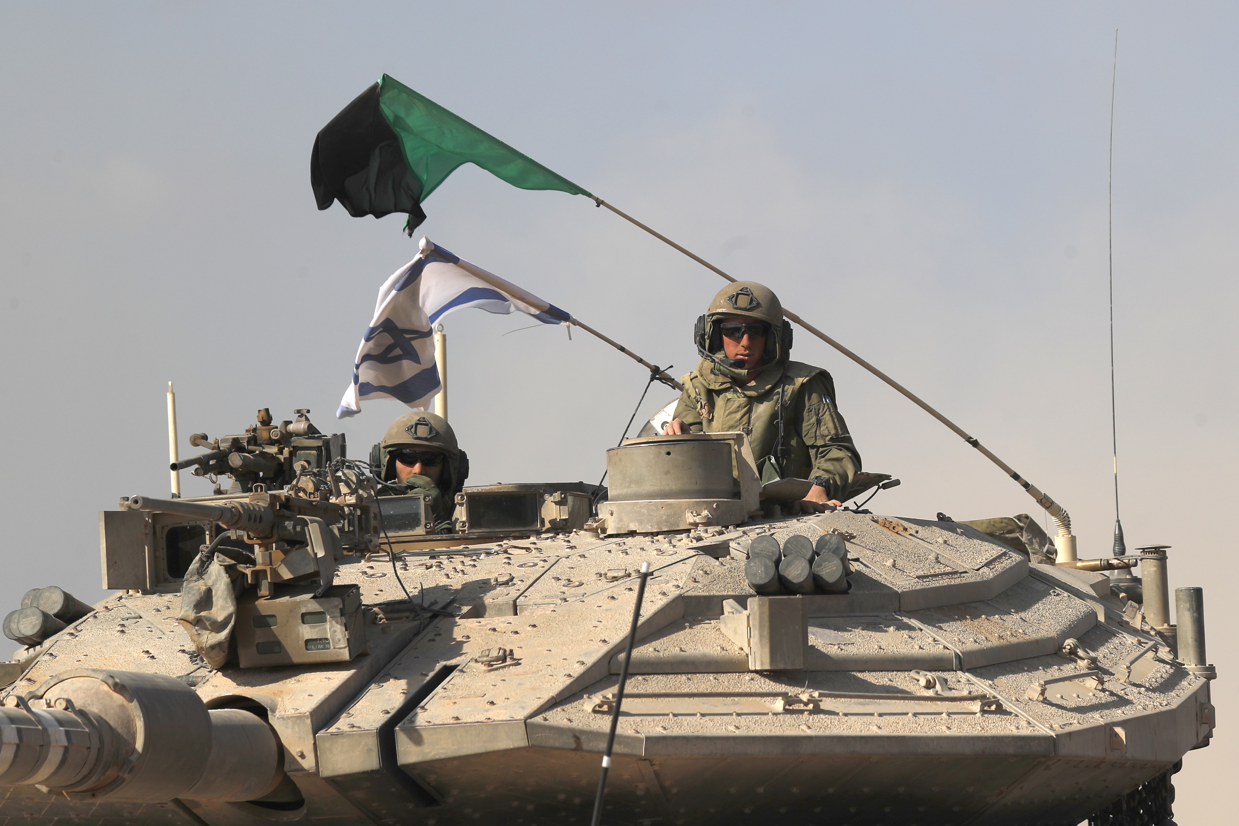 Undisclosed (Israel), 13/10/2023.- A 'Merkava' battle tank carrying Israeli soldiers at an area along the border with Gaza, southern Israel, 13 October 2023. The Israel Defense Forces (IDF) on 13 October called for the evacuation of all civilians of Gaza City from their homes southwards 'for their own safety and protection' and to move south of the Wadi Gaza, warning that in the following days Israeli military operations will take place in the Palestinian city. More than 1,300 Israelis have been killed and over 3,200 others injured, according to the IDF, after the Islamist movement Hamas launched an attack against Israel from the Gaza Strip on 07 October. More than 1,500 Palestinians have been killed and over 6,600 others injured in Gaza since Israel launched retaliatory air strikes, Palestinian health officials said. EFE/EPA/ATEF SAFADI