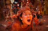 La fiesta "tomatina" y un gato en la final de atletismo en los Juegos Africanos en las mejores fotos de la semana