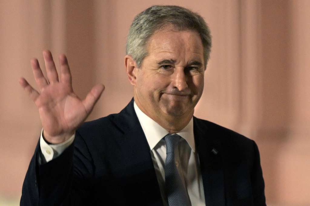Picture taken on April 11, 2025 of the then Argentina's Finance Secretary Pablo Quirno waving while leaving the Casa Rosada government palace in Buenos Aires.