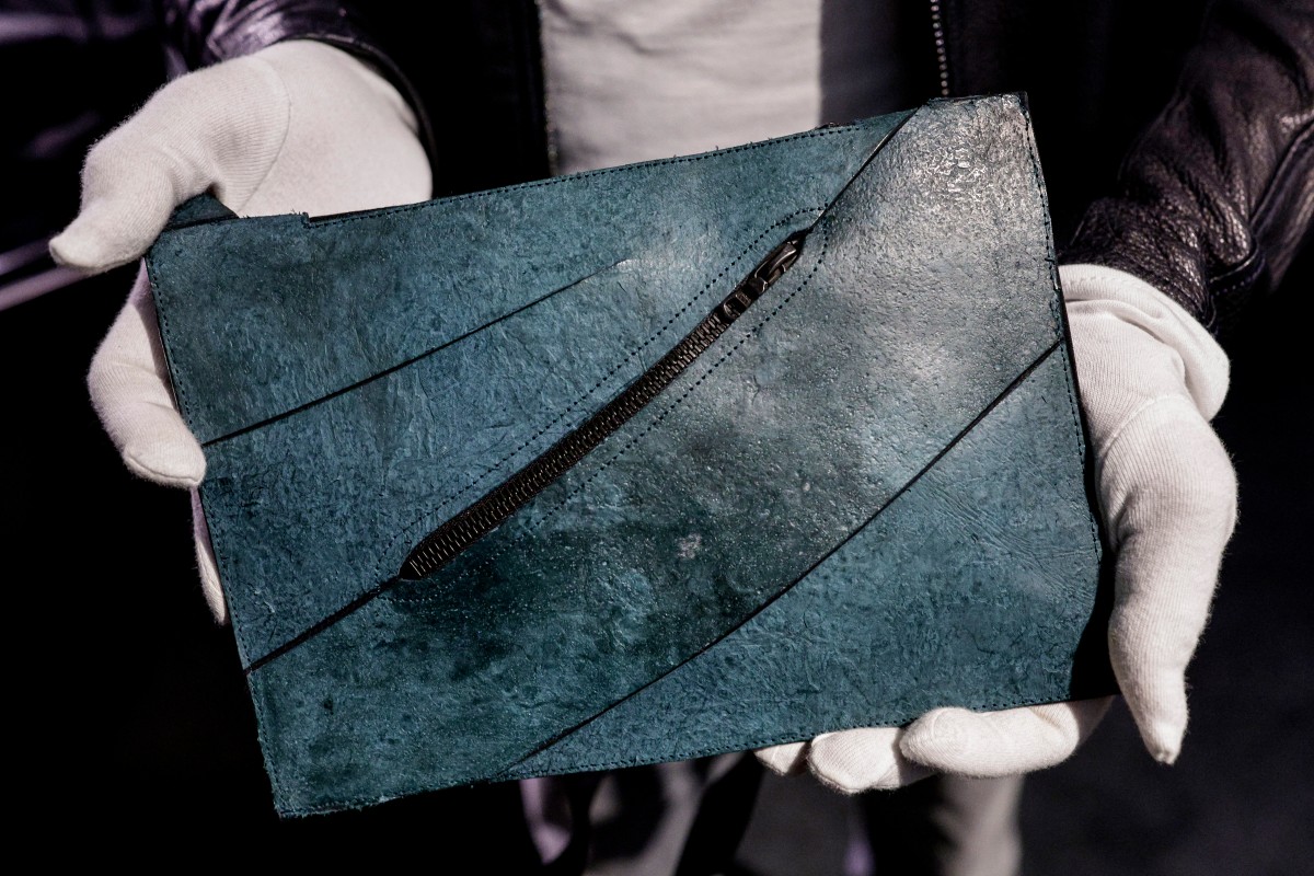 This photograph shows the first "T-Rex leather" bag on display ahead of its auction at the Hotel Drouot auction venue in Paris on June 9, 2026. On June 11, 2026, as part of its sale at the Hotel Drouot, Giquello will present the world�s first bag made from T-Rex Leather, estimated at between �300,000 and �500,000. (Photo by STEPHANE DE SAKUTIN / AFP)