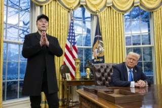 Elon Musk speaks as US President Donald Trump looks on in the Oval Office of the White House in Washington, DC, on February 11, 2025.