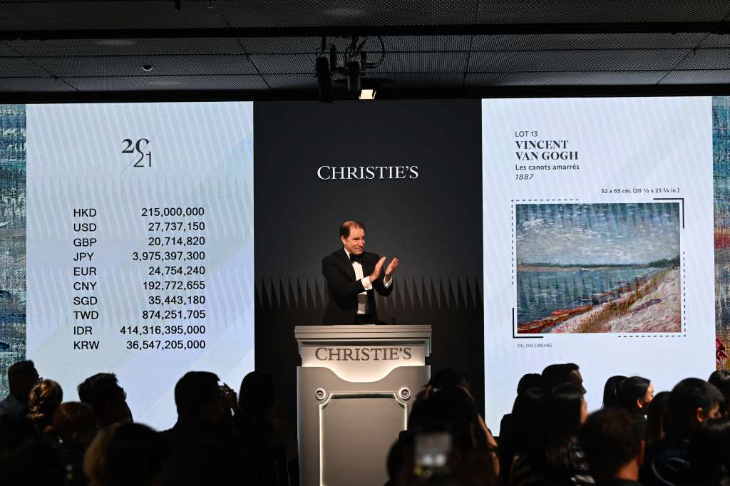 Bids are taken on "Les canots amarrés" by Vincent Van Gogh from 1887, which sold at auction at Christie’s Hong Kong headquarters for HK$215,000,000 (US$27.7million) in Hong Kong on September 26, 2024. (Photo by Peter PARKS / AFP) / RESTRICTED TO EDITORIAL USE - MANDATORY MENTION OF THE ARTIST UPON PUBLICATION - TO ILLUSTRATE THE EVENT AS SPECIFIED IN THE CAPTION