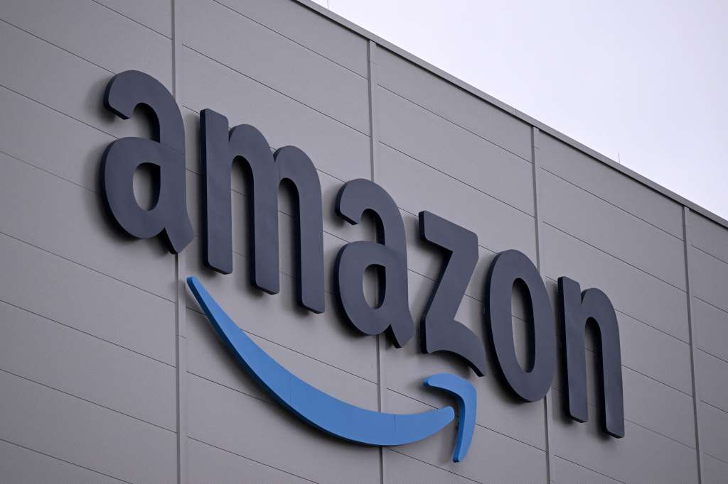 (FILES) The logo of US online retail giant Amazon is seen on the facade of a redistribution centre in Horn-Bad Meinberg, western Germany, on December 9, 2024.