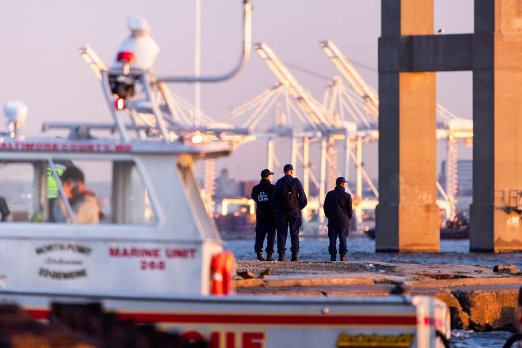 Baltimore (United States), 26/03/2024.- Rescue personnel gather on the shore of the Patapsco River after a container ship knocked down the Francis Scott Key Bridge in Baltimore, Maryland, USA, 26 March 2024. The Maryland Department of Transportation (MDOT) confirmed that the Francis Scott Key Bridge collapsed due to a ship strike on 26 March. Two people were rescued while at least six others were still missing, the MDOT Secretary said in a press conference, adding that they are believed to be members of a construction crew working on the bridge at the time of the incident. EFE/EPA/JIM LO SCALZO