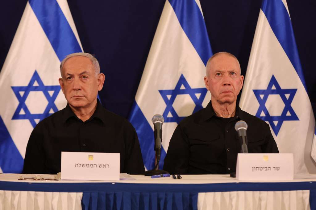 (FILES) Israeli Prime Minister Benjamin Netanyahu (L) and Defence Minister Yoav Gallant attend a press conference in the Kirya military base in Tel Aviv on October 28, 2023 amid ongoing battles between Israel and the Palestinian group Hamas.