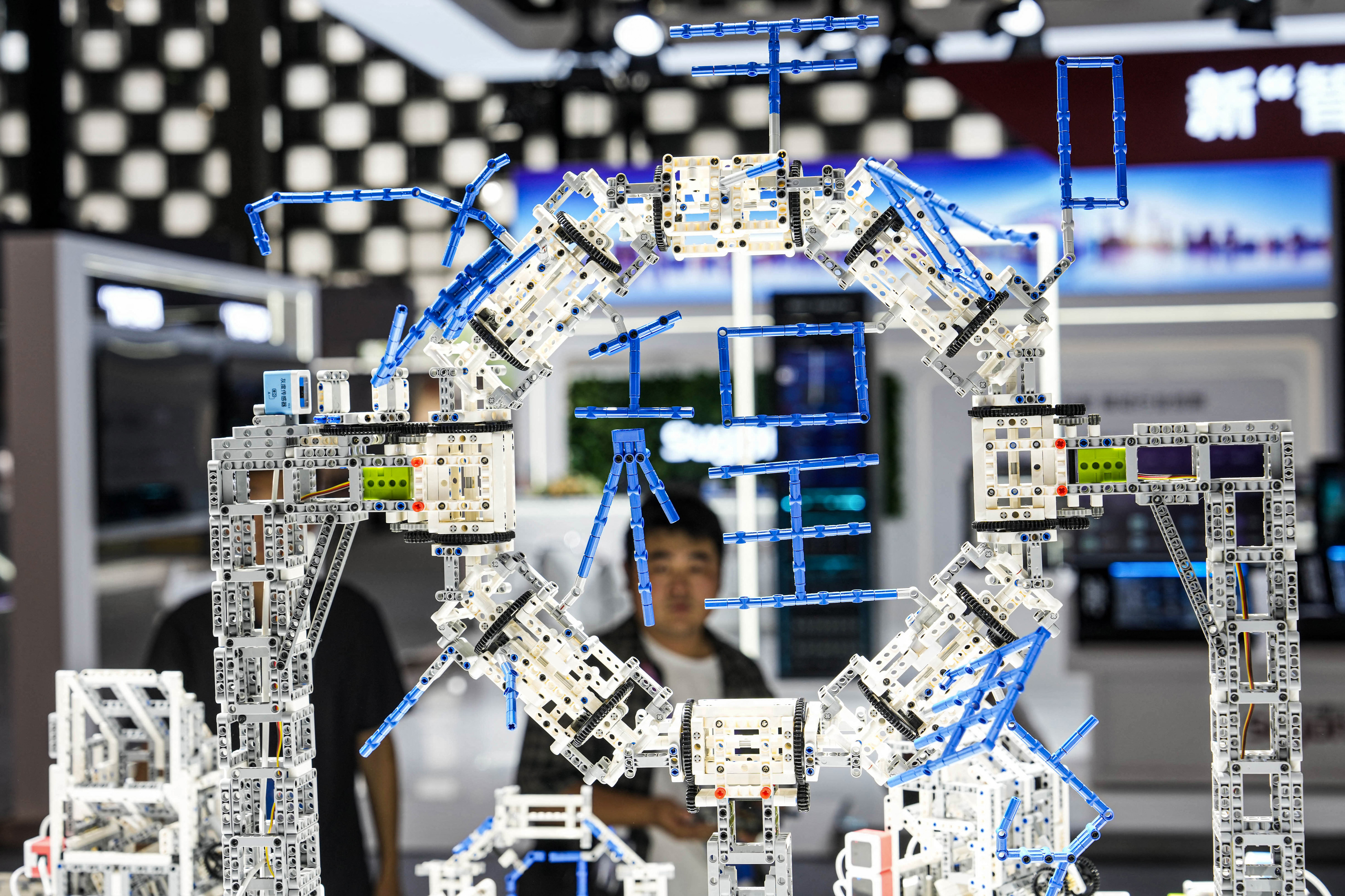 People visit the World Artificial Intelligence Conference (WAIC) in Shanghai on July 4, 2024. (Photo by AFP) / CHINA OUT