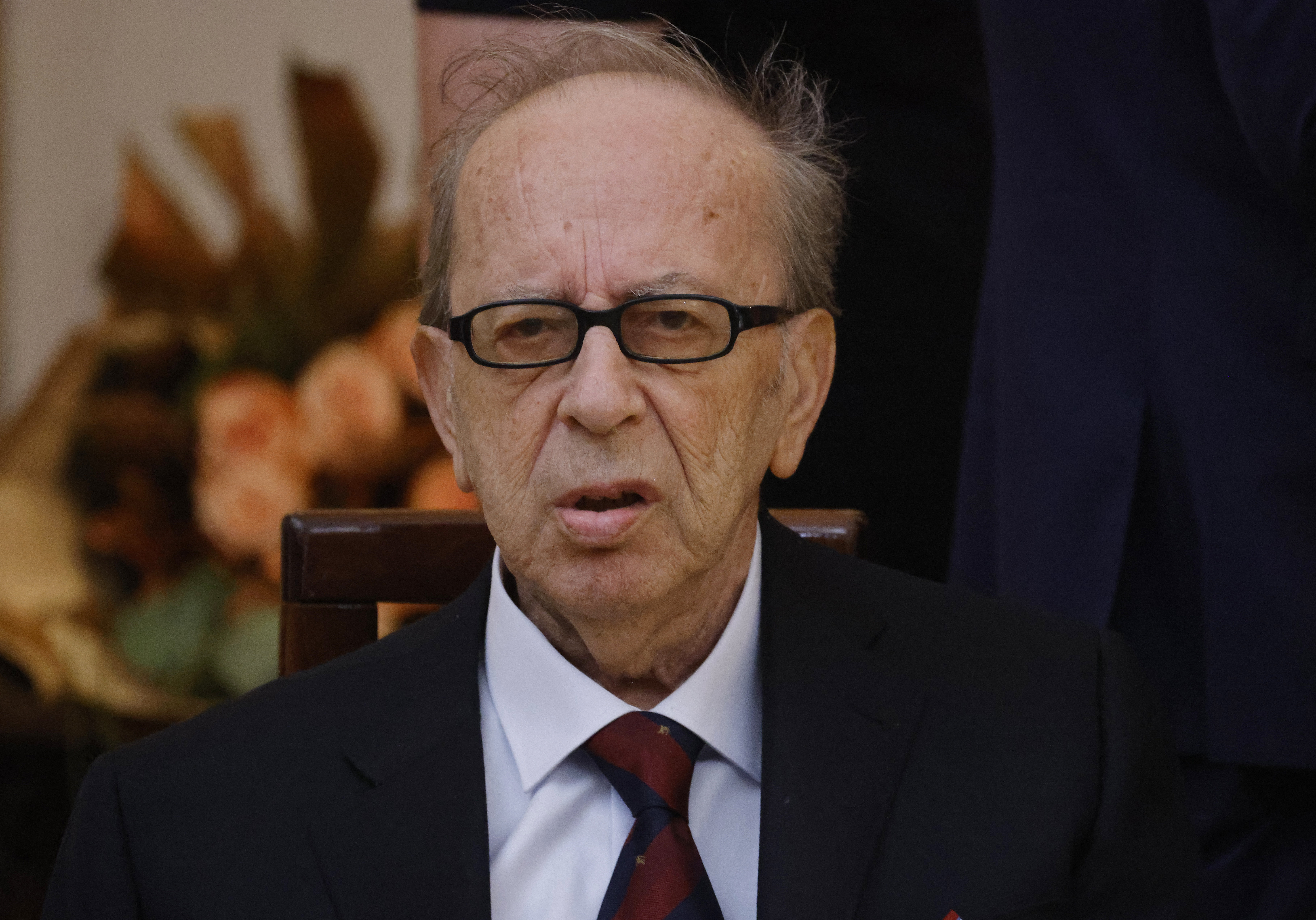 (FILES) Renowned Albanian writer Ismail Kadare listens to the French President's speech during a meeting at the Palace of Brigades in Tirana, on October 16, 2023.