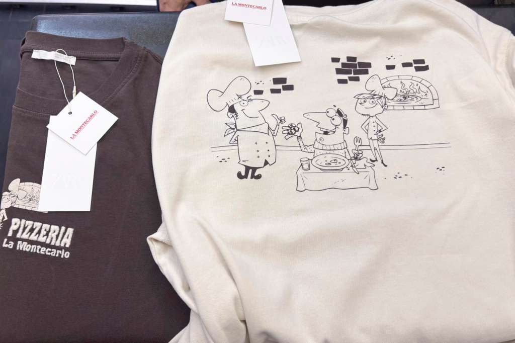 ROMA, 19/12/2025.-- La mítica pizzería romana "La Montecarlo" celebra cuatro décadas de historia con una colaboración peculiar: su logo e identidad estampados en camisetas y sudaderas de la marca española Zara, una iniciativa que ha conseguido "sintetizar cuarenta años de un local histórico de Roma", afirmó a EFE el dueño, Carlo Muzi. EFE/ Carlos Expósito