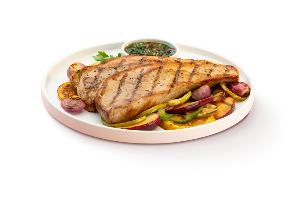 Punta de anca de cerdo con vegetales y frutas grilladas