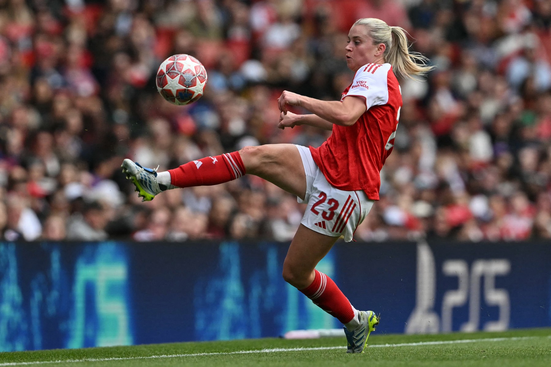 Arsenal's English striker #23 Alessia Russo controls the ball during the women's UEFA Champions League first-leg semi-final football match between Arsenal and OL Lyonnes at the Emirates Stadium, north London, on April 26, 2026.
