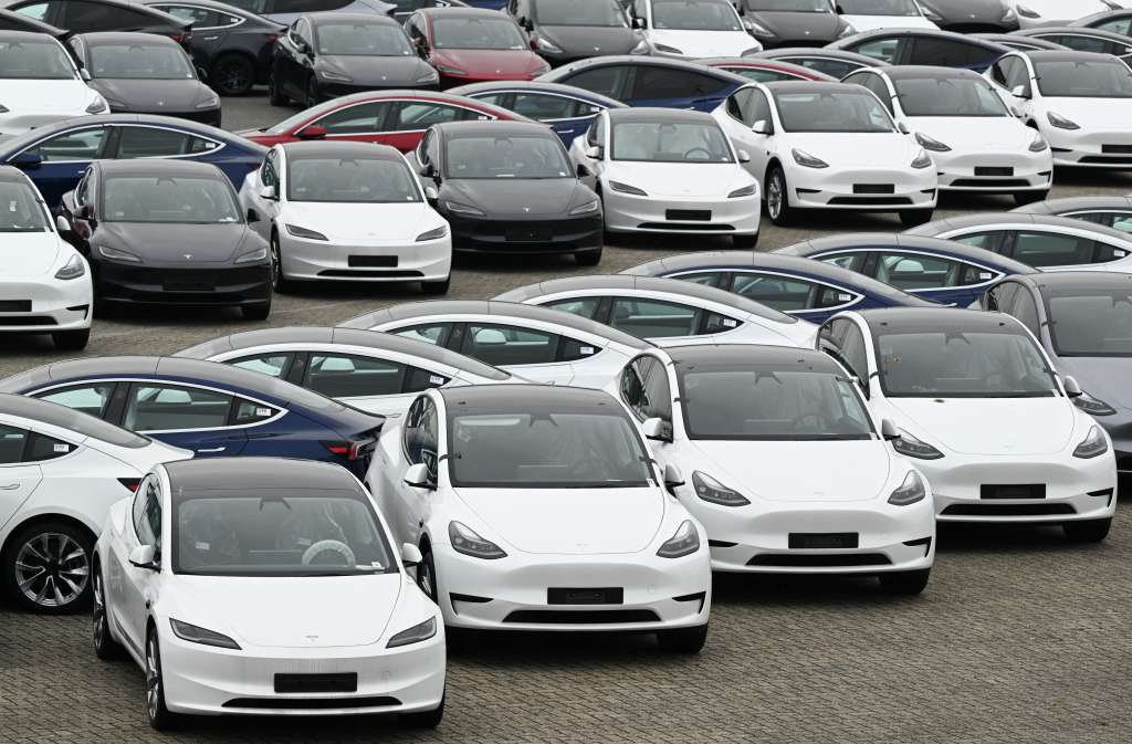 (FILES) Tesla electric cars are stationed in a storage area in the Zeebrugge port, northern Belgium on June 21, 2024.