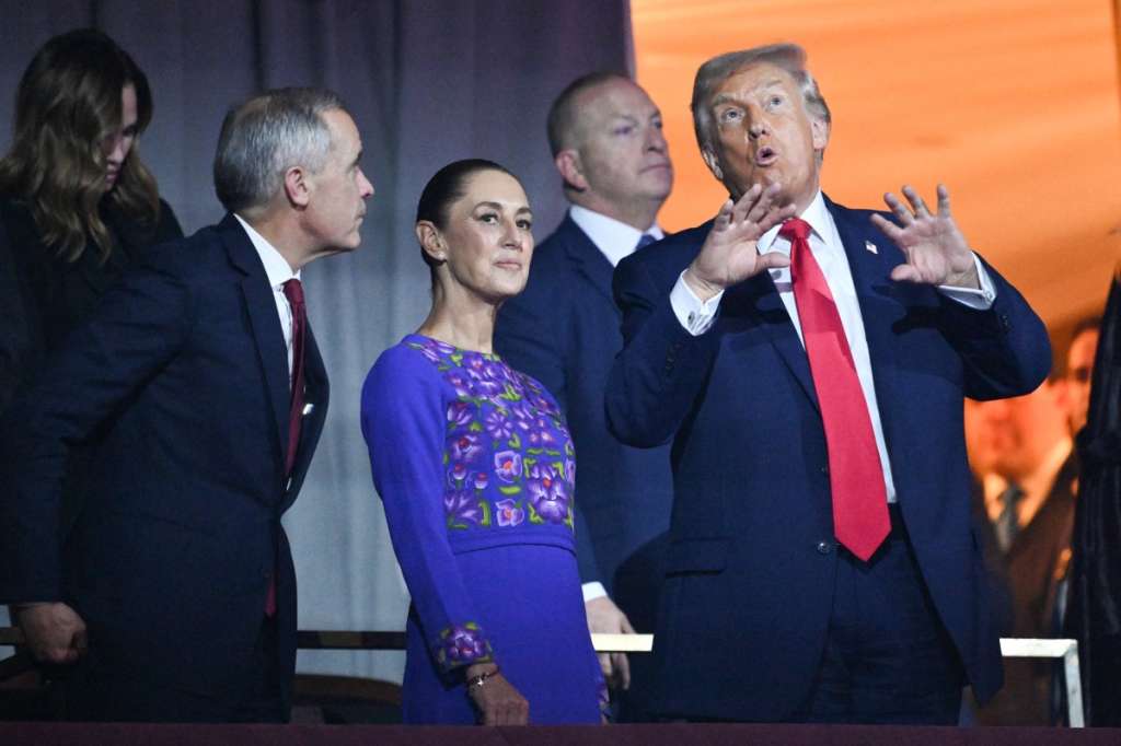 (FILES) (L/R) Canada's Prime Minister Mark Carney, Mexico's President Claudia Sheinbaum, and US President Donald Trump speak with each other during the draw for the 2026 FIFA Football World Cup taking place in the US, Canada and Mexico, at the Kennedy Center, in Washington, DC, on December 5, 2025.