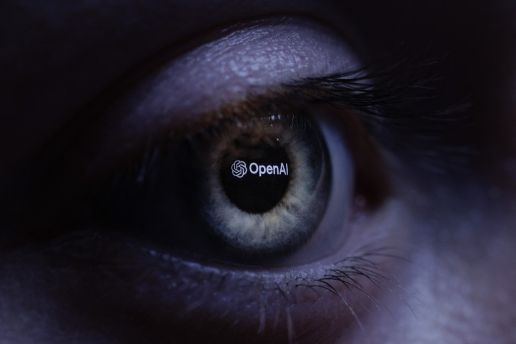 (FILES) This illustration photograph taken with a macro lens shows an 'OpenAI' logo reverse projected onto a human eye at a studio in Paris on June 6, 2023.