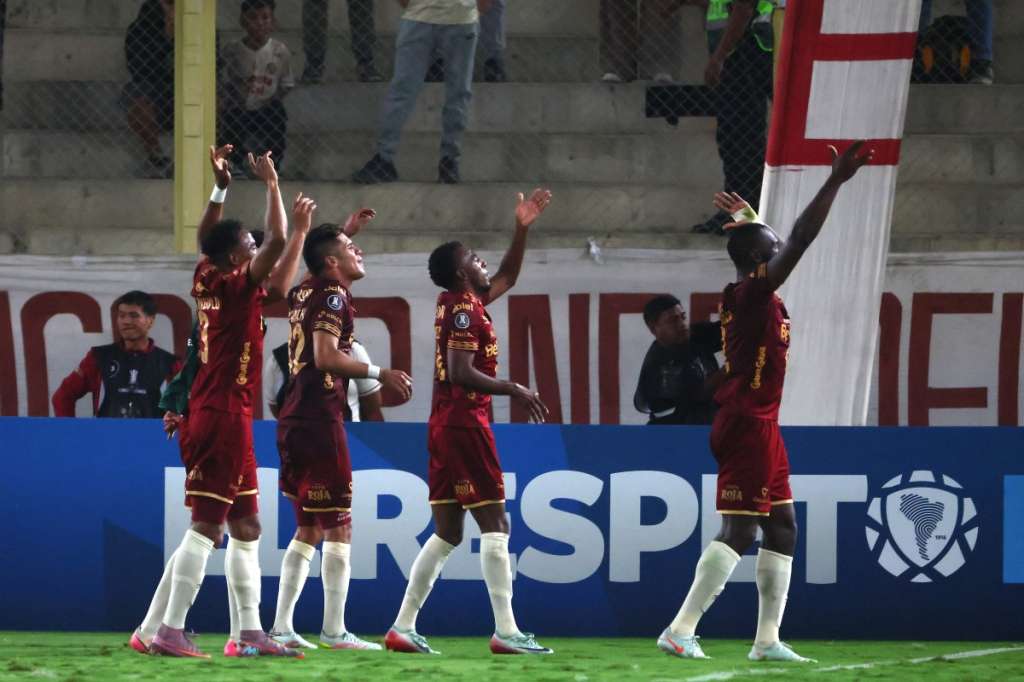 Deportes Tolima players celebrate at the end of the Copa Libertadores group stage football match between Peru's Universitario and Colombia's Deportes Tolima at the Monumental "U" Marathon stadium in Lima on May 26, 2026. (Photo by Connie FRANCE / AFP)