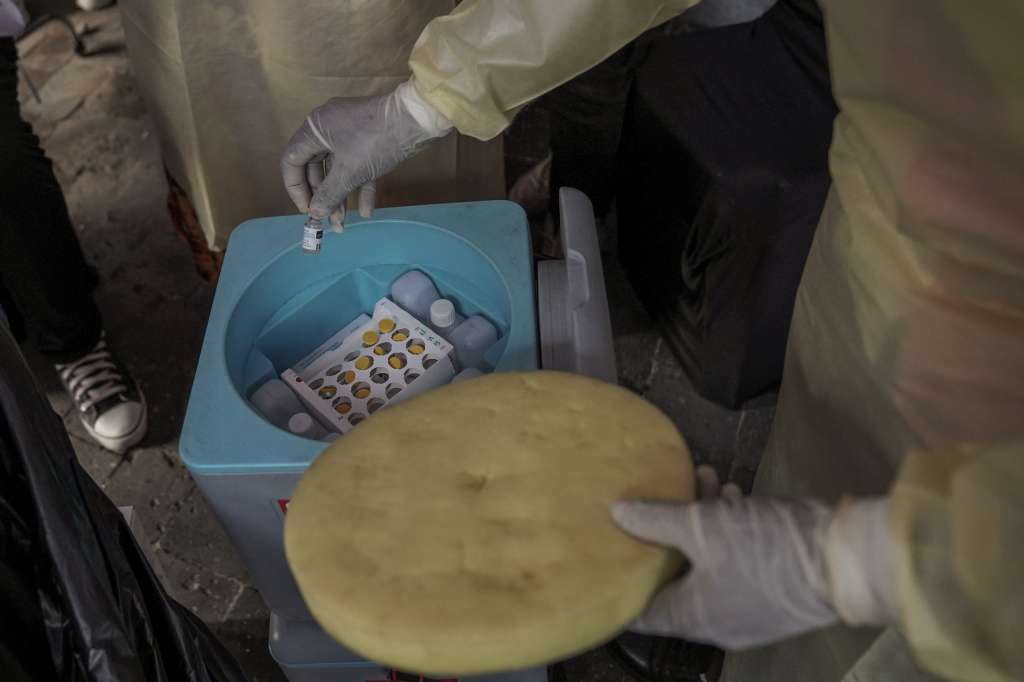 A clinician holds a vial of the mpox vaccine during the launch of the vaccination campaign at the General Hospital of Goma, on October 5, 2024.