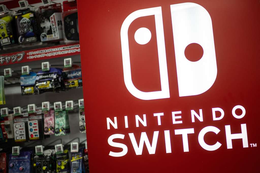 The Nintendo Switch logo is seen beside products for sale at the gaming section of a shop in Tokyo on January 16, 2025.