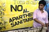 Rebelión en España contra exclusión de sin papeles de salud pública