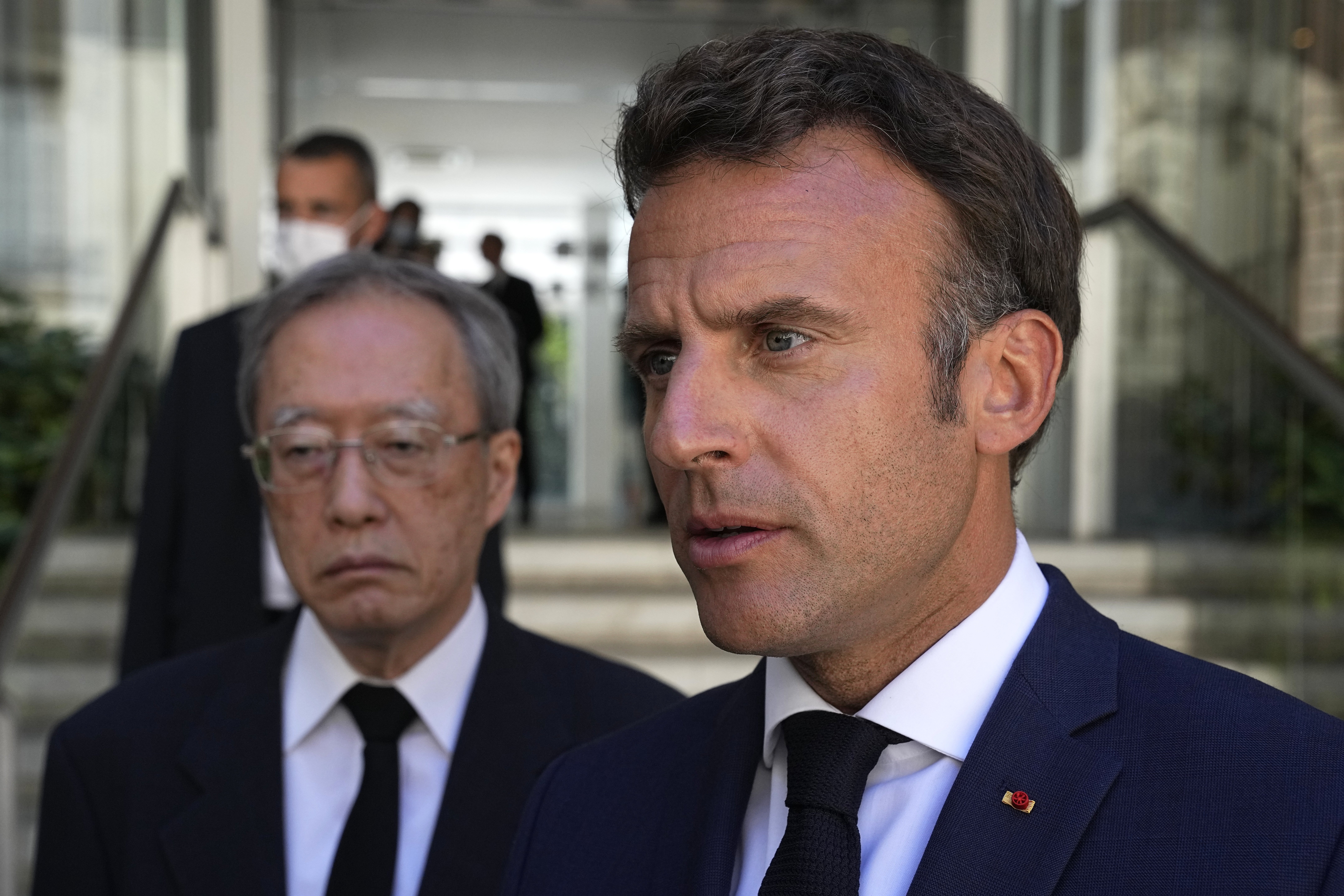 Paris (France), 11/07/2022.- French President Emmanuel Macron and Japan'Äôs ambassador to France Ihara Junichi brief the media outside at the residence of Japan'Äôs ambassador to France in Paris, 11 July 2022. French President Emmanuel Macron signed a condolences book after Shinzo Abe was assassinated Friday while campaigning in Nara, western Japan. (Francia, Japón) EFE/EPA/Michel Euler / POOL MAXPPP OUT