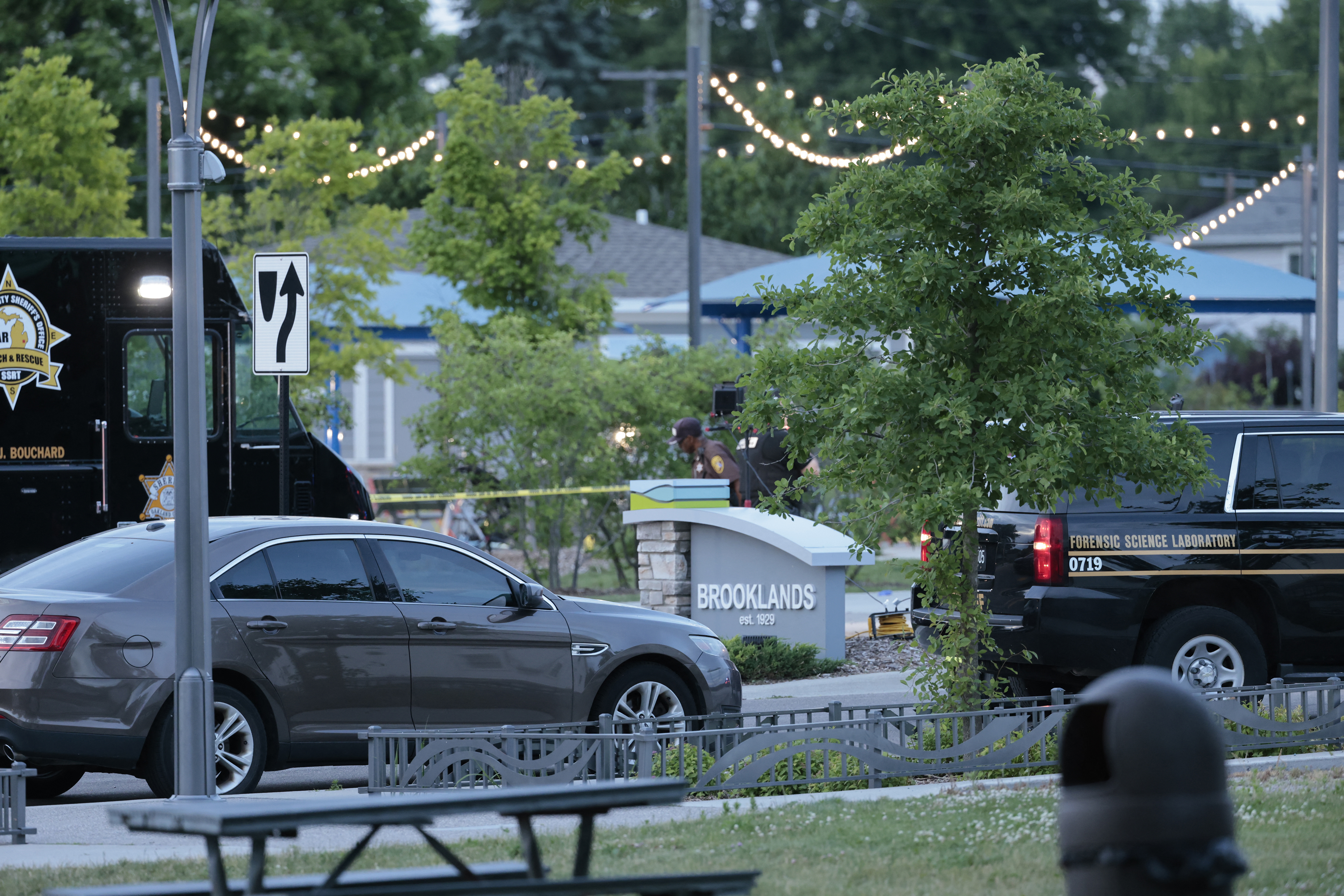 Oakland County Sheriff Evidence Technicians document the scene where a shooting took place at Brooklands Plaza Splash Pad in Rochester Hills, Michigan, on June 15, 2024.