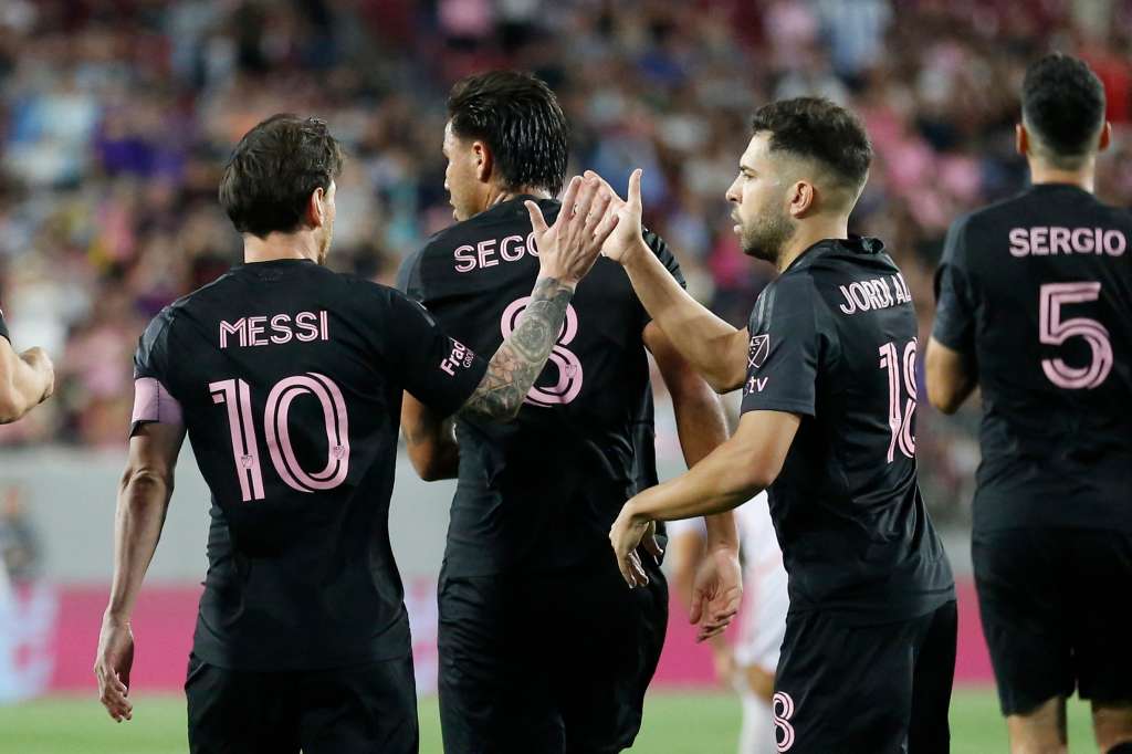 Inter Miami's forward #10 Lionel Messi celebrates with teammates after they scored a goal during a preseason friendly football match between Orlando City SC and Inter Miami CF at Raymond James Stadium in Tampa, Florida, on February 14, 2025. (Photo by OCTAVIO JONES / AFP)